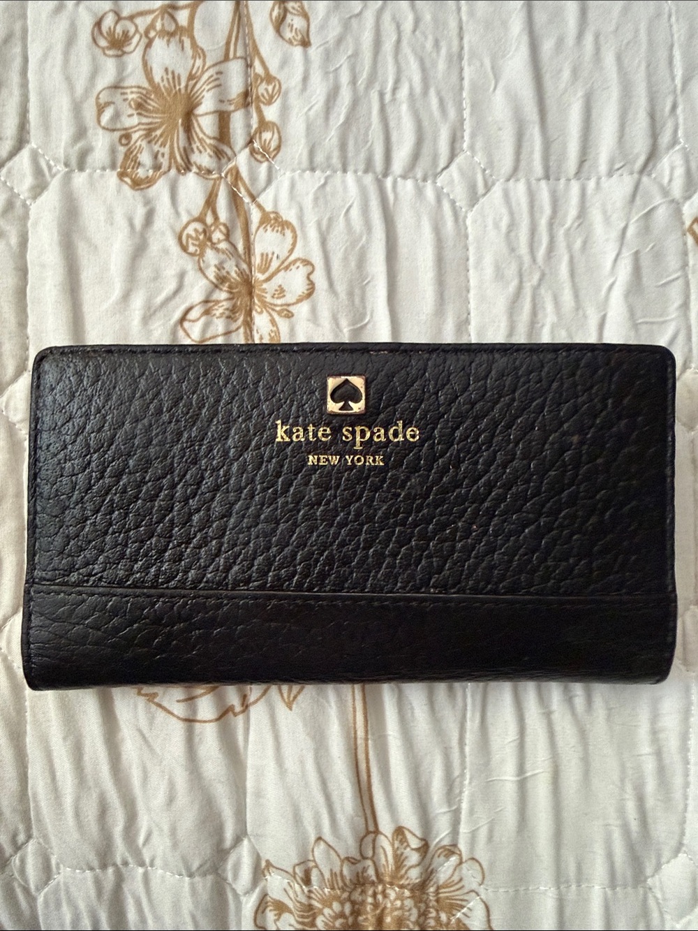 kate spade black pebbled leather continental wallet with gold logo